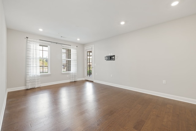 empty room featuring dark wood-type flooring