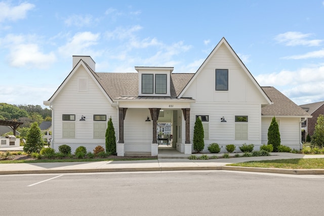 modern farmhouse style home with covered porch