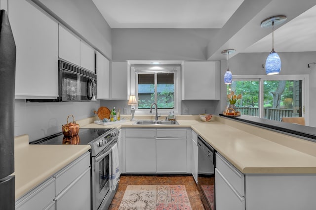 kitchen featuring hanging light fixtures, black appliances, sink, and white cabinets