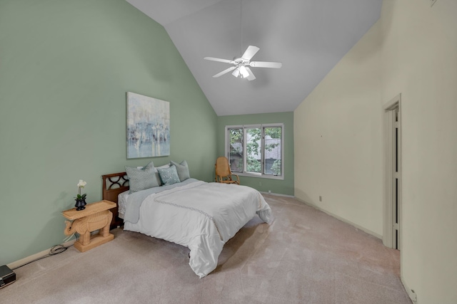 bedroom with high vaulted ceiling, ceiling fan, and light colored carpet