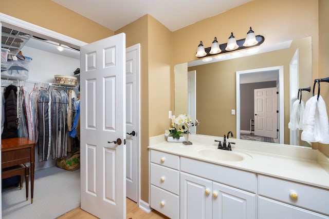 bathroom with wood-type flooring and vanity