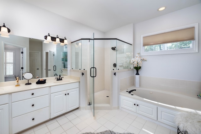 bathroom with vanity, separate shower and tub, tile patterned floors, and a wealth of natural light