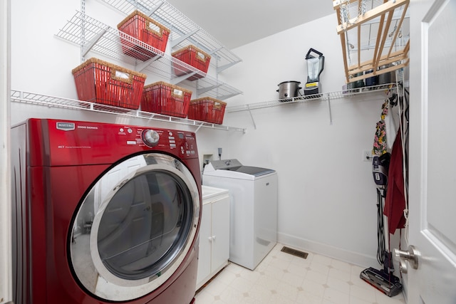 laundry area with washing machine and dryer