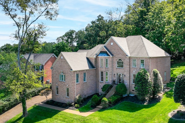 view of front of home with a front lawn