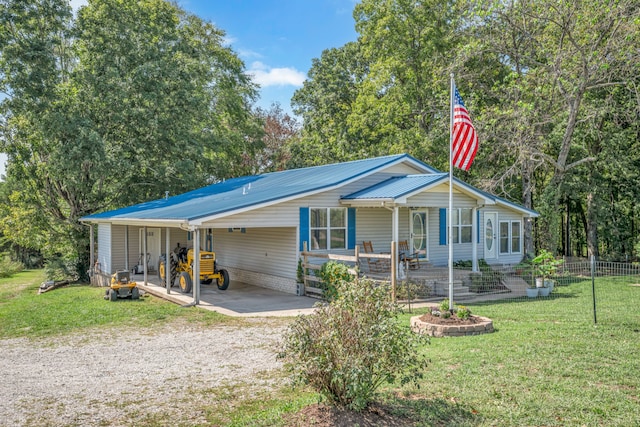 ranch-style house featuring a front lawn and a carport