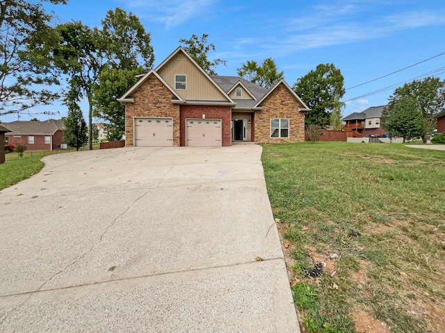 view of front of home featuring a front lawn and a garage