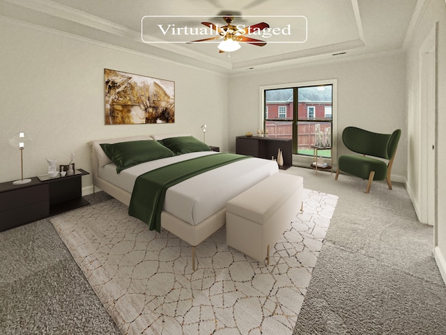 carpeted bedroom featuring ceiling fan, a raised ceiling, and crown molding