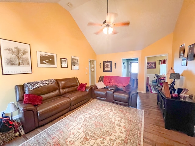 living room featuring lofted ceiling, ceiling fan, and hardwood / wood-style flooring