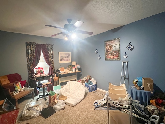 interior space featuring carpet floors, a textured ceiling, and ceiling fan