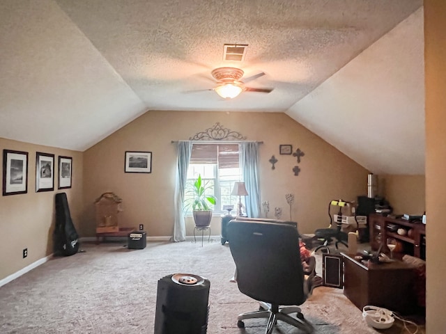 carpeted office with ceiling fan, a textured ceiling, and lofted ceiling