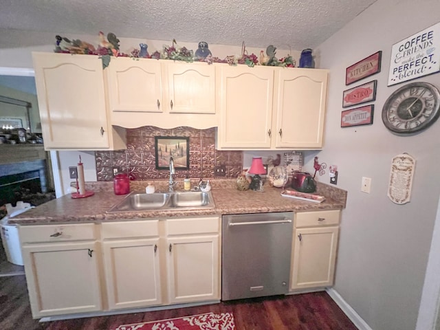 kitchen featuring backsplash, dishwasher, a textured ceiling, dark hardwood / wood-style floors, and sink