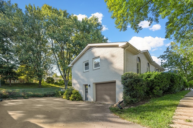 view of side of property with a garage