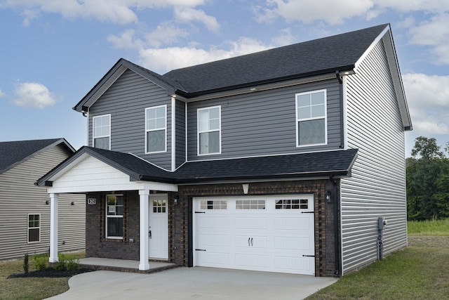 view of front of house with a garage, driveway, and roof with shingles