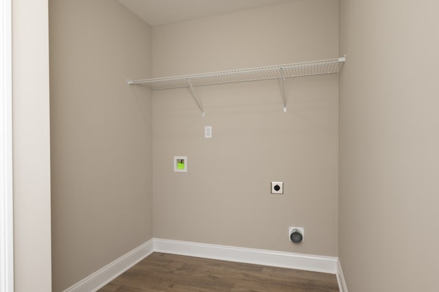 clothes washing area with electric dryer hookup, hookup for a washing machine, and dark hardwood / wood-style floors