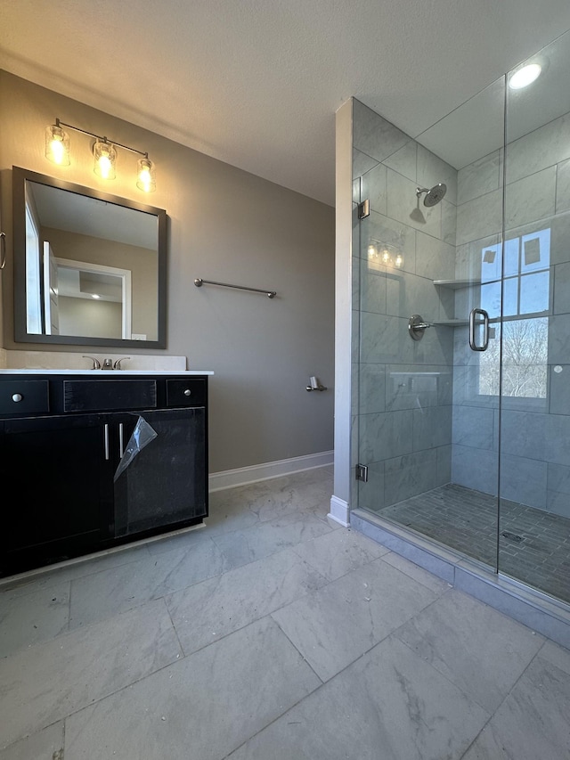 bathroom featuring vanity and an enclosed shower