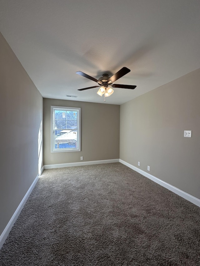 empty room with carpet floors and ceiling fan