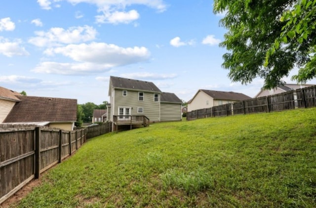 view of yard with a wooden deck