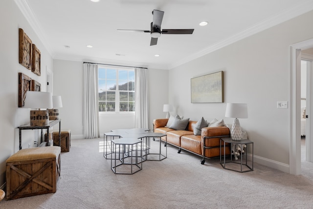 living room with ceiling fan, light carpet, and ornamental molding