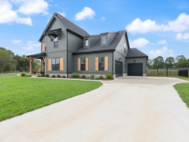 view of front facade with a garage and a front lawn