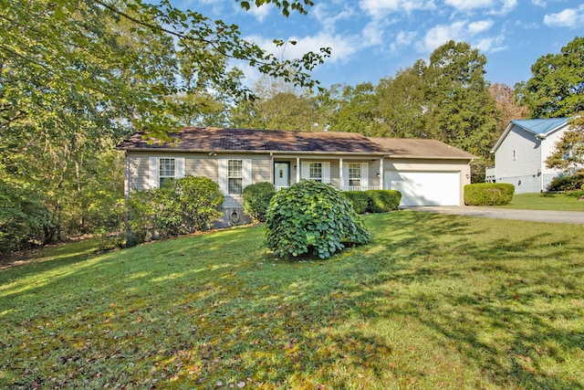 single story home with a garage and a front yard