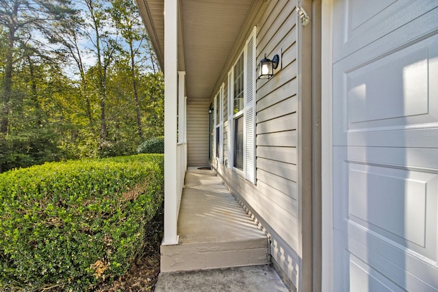 view of property exterior featuring a porch