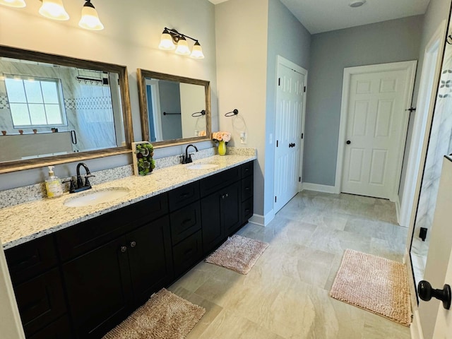 bathroom with a shower and vanity