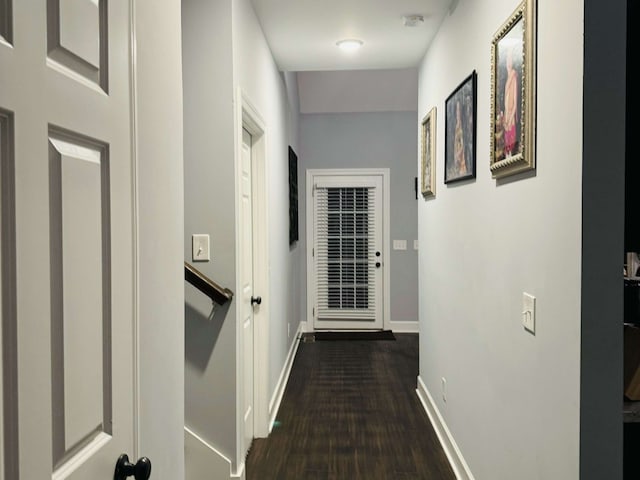 corridor with dark hardwood / wood-style floors