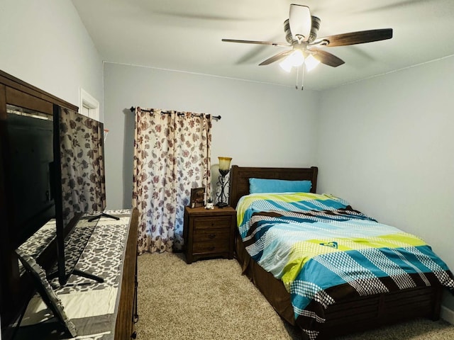 bedroom with ceiling fan and light colored carpet