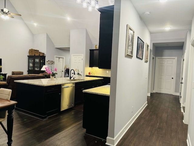 kitchen featuring dishwasher, dark hardwood / wood-style floors, a kitchen island with sink, sink, and ceiling fan