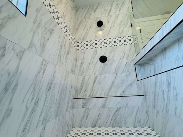 details with a tile shower