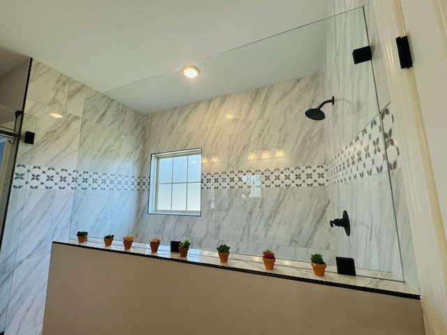 bathroom with a tile shower