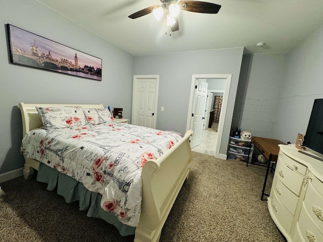 bedroom featuring light carpet and ceiling fan