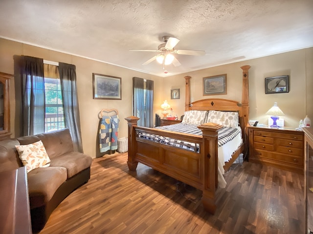 bedroom featuring a textured ceiling, ceiling fan, crown molding, and dark hardwood / wood-style flooring