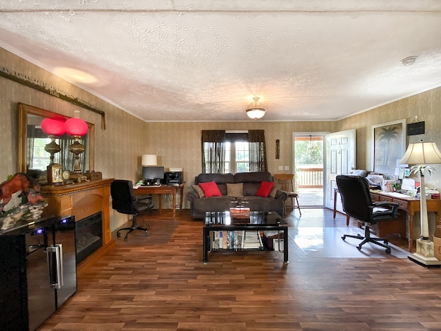 living room featuring a textured ceiling, crown molding, and dark hardwood / wood-style floors