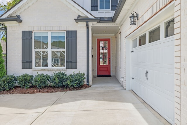 view of exterior entry with a garage