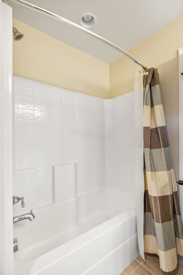 bathroom featuring shower / tub combo with curtain