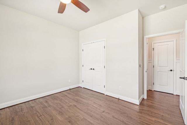 unfurnished bedroom with ceiling fan and light wood-type flooring