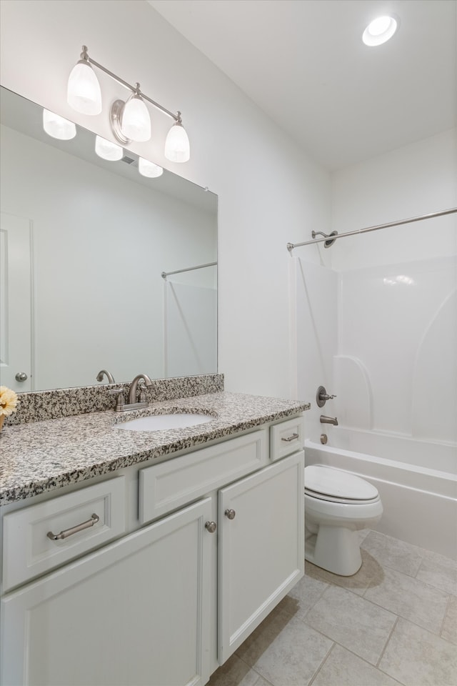 full bathroom with tile patterned floors,  shower combination, vanity, and toilet