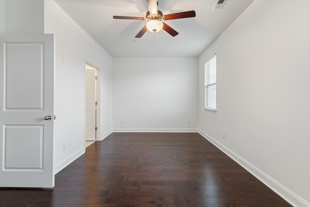 spare room featuring ceiling fan and dark hardwood / wood-style floors