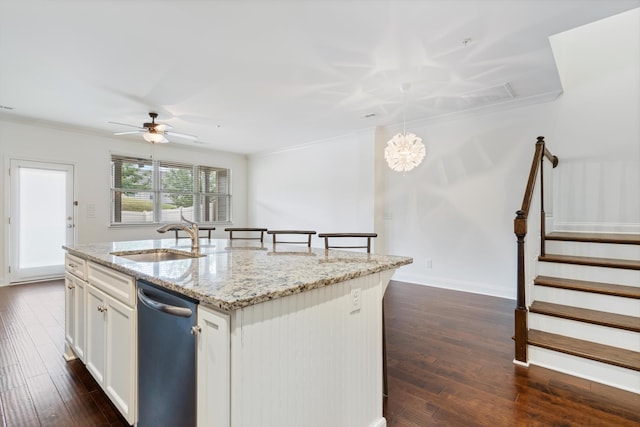 kitchen with dishwasher, a center island with sink, sink, and dark hardwood / wood-style flooring