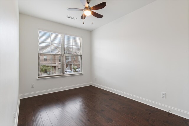 unfurnished room with ceiling fan, plenty of natural light, and dark hardwood / wood-style flooring