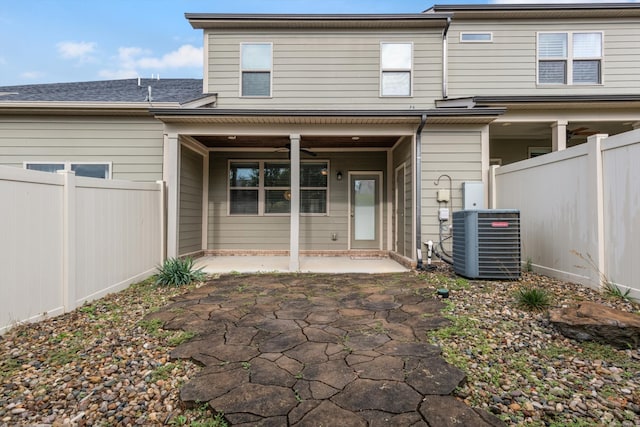 back of house with a patio and central air condition unit