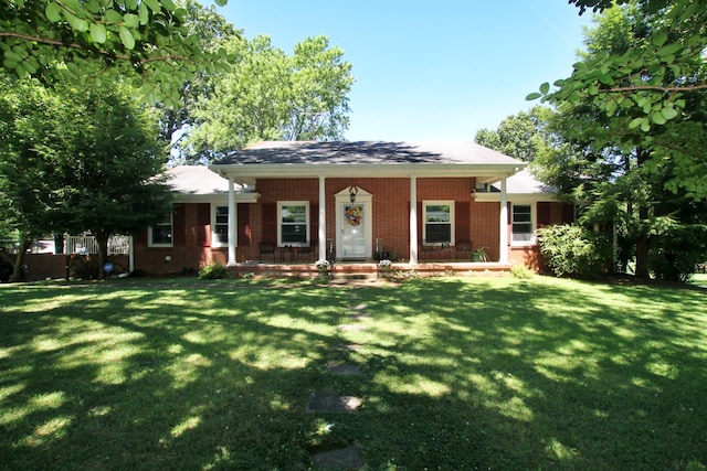 view of front of house featuring a front yard and covered porch