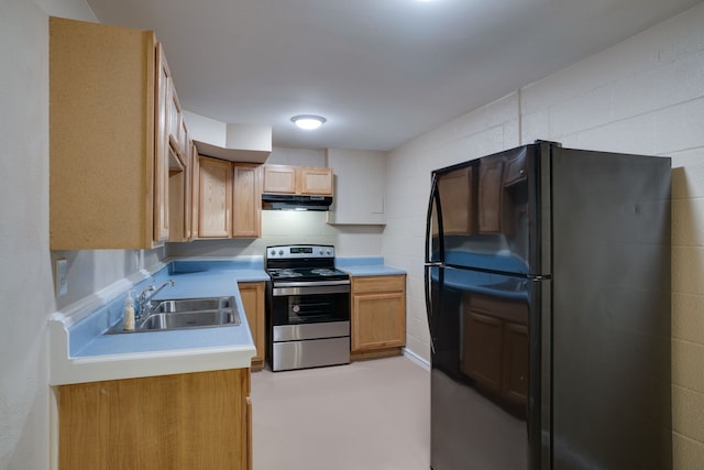 kitchen featuring stainless steel electric stove, sink, and black refrigerator