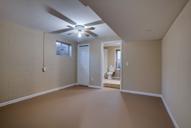 spare room with concrete floors and ceiling fan