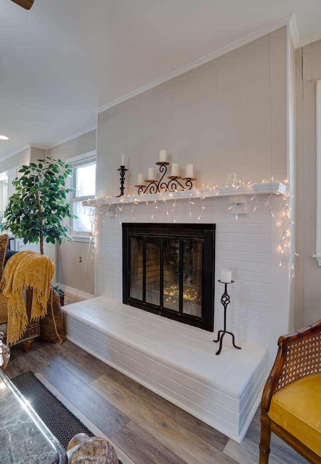 details with ornamental molding and hardwood / wood-style floors