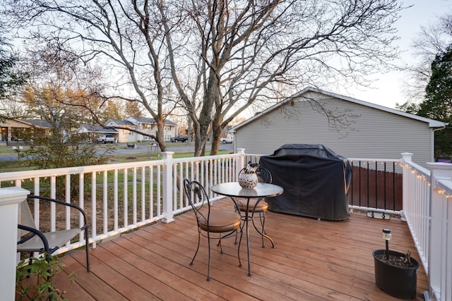 wooden terrace with a grill