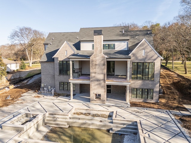 back of house featuring a patio area