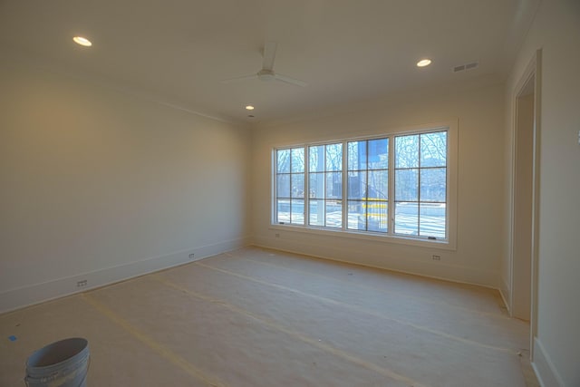 spare room featuring crown molding and ceiling fan