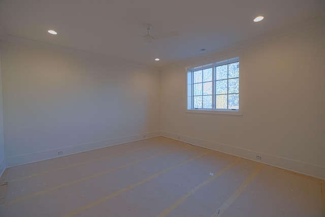 empty room featuring ornamental molding and ceiling fan